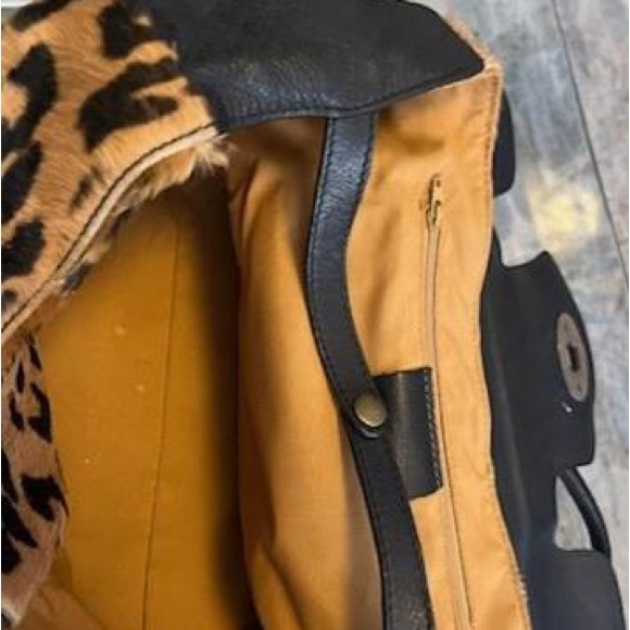 Leather leopard print handbag.